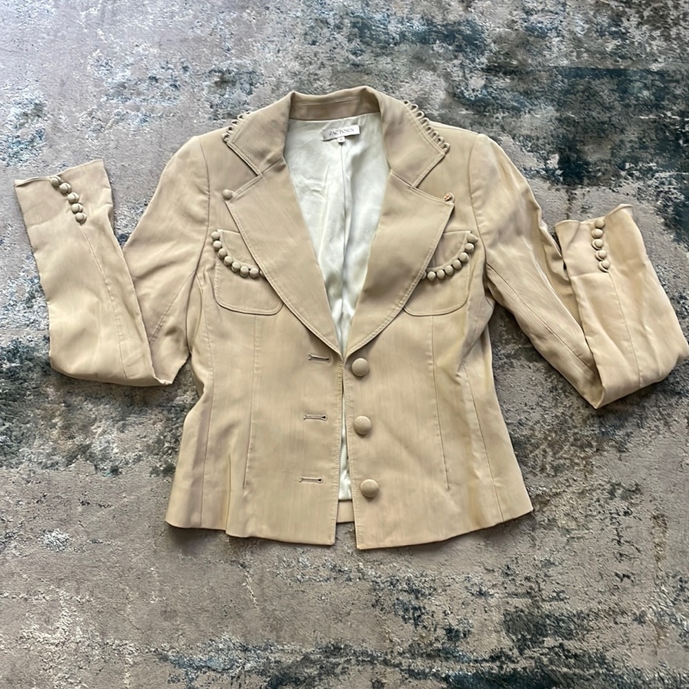 Like new condition with one button missing on the top. Easy fix for style!